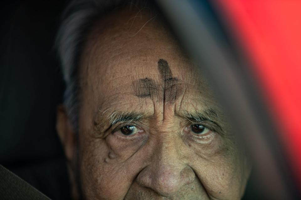 Jose M. Garcia receives ashes and a blessing from Fr. Keith Davis during All Saints' Episcopal Church's "ashes-to-go" event on Ash Wednesday, Feb. 22, 2023, in Corpus Christi, Texas.