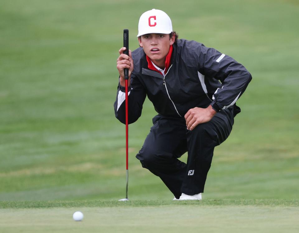 Crimson Cliffs’ Boston Bracken lines up a putt on his way to winning the individual championship in the 4A boys golf tournament at The Ridge Golf Club in West Valley City on Thursday, Oct. 12, 2023. | Jeffrey D. Allred, Deseret News