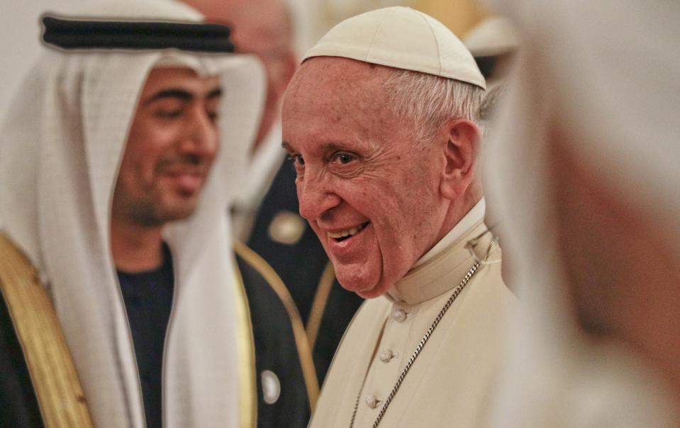 Pope Francis smiles upon his arrival at the Abu Dhabi airport, United Arab Emirates, Sunday, Feb. 3, 2019. Francis travelled to Abu Dhabi to participate in a conference on interreligious dialogue sponsored the Emirates-based Muslim Council of Elders, an initiative that seeks to counter religious fanaticism by promoting a moderate brand of Islam. (AP Photo/Andrew Medichini, Pool)