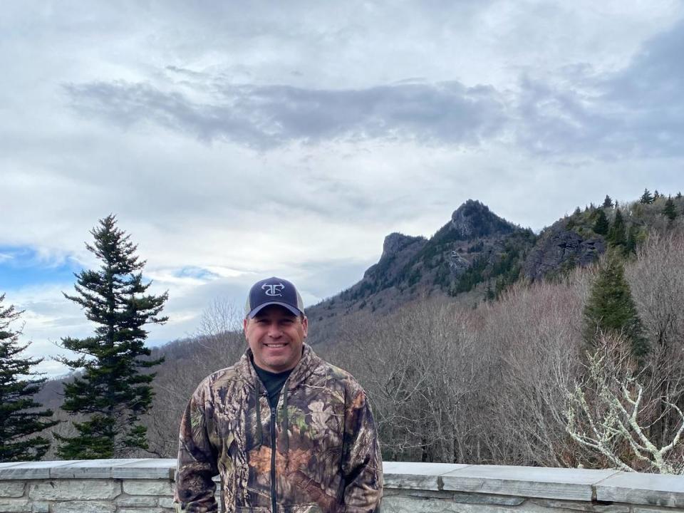 NASCAR driver Ryan Newman poses at the Grandfather Mountain nature park when he took Doc the elk from the park to his Rescue Ranch in Statesville, NC, in April 2022.