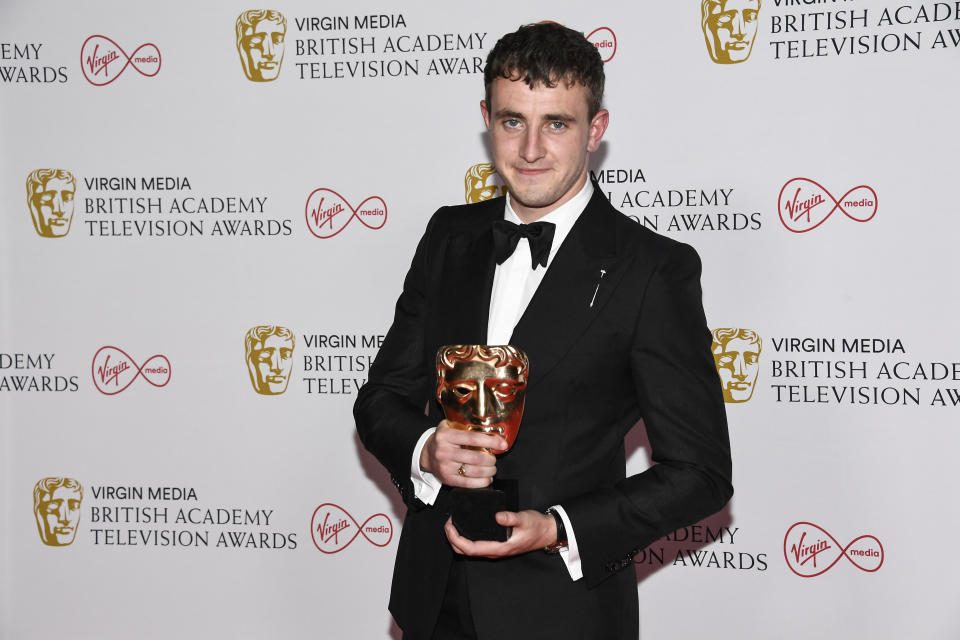 Paul Mescal poses for photographers with his Leading Actor award for his role in 'Normal People' backstage at the British Academy Television Awards in London, Sunday, June 6, 2021. (AP Photo/Alberto Pezzali)