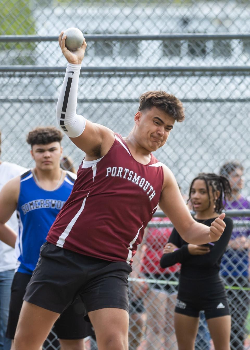 Portsmouth's Caiden Paolucci throws the shot put at Friday's Seacoast Track Championship meet at Exeter High School.