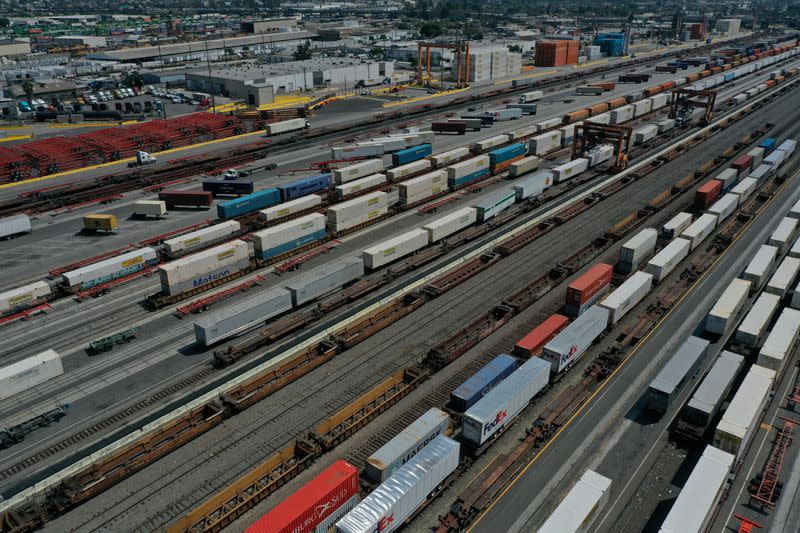 FILE PHOTO: An aerial view of shipping containers and freight railway trains at the BNSF Los Angeles Intermodal Facility rail yard in Los Angele