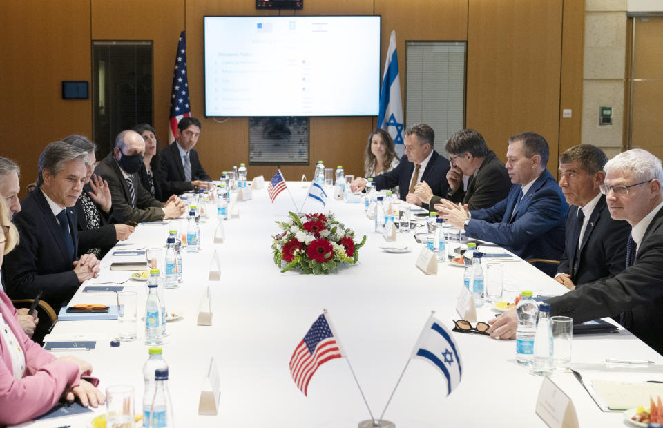 Secretary of State Antony Blinken is seated with Israeli Foreign Minister Gabi Ashkenazi, second from right, before their meeting at the Ministry of Foreign Affairs, Tuesday, May 25, 2021, in Jerusalem, Israel. (AP Photo/Alex Brandon, Pool)