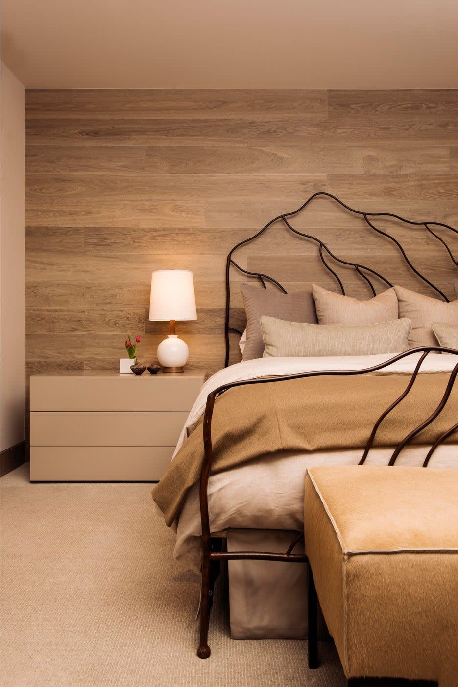 <p>A modern take on rustic design, this bedroom features a wood accent wall and neutral color palette. Located in Aspen, the home is designed by <a href="https://www.chairish.com/shop/robyn-scott-interiors" rel="nofollow noopener" target="_blank" data-ylk="slk:Robyn Scott Interiors;elm:context_link;itc:0;sec:content-canvas" class="link ">Robyn Scott Interiors</a>.</p>