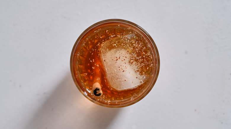 nutmeg sprinkled onto cocktail