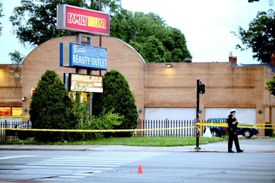 Police investigate the scene after 16-year-old Galevon Beauchamp was killed June 21, 2021, in a drive-by shooting outside a North Avondale Family Dollar.