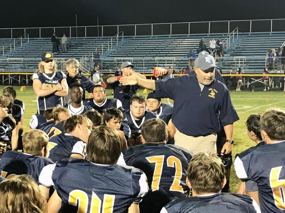 River Valley head coach Doug Green talks to his football team after beating Highland last season.