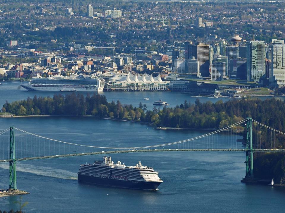 Holland America Zuiderdam passing under the Lions Gate bridge in Vancouver, Canada in 2022.