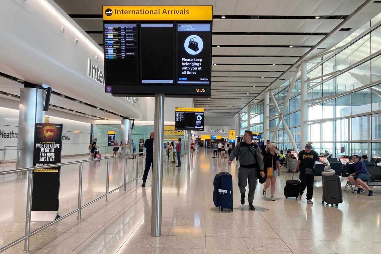 People in Terminal 2 arrivals at London Heathrow earlier in May: PA