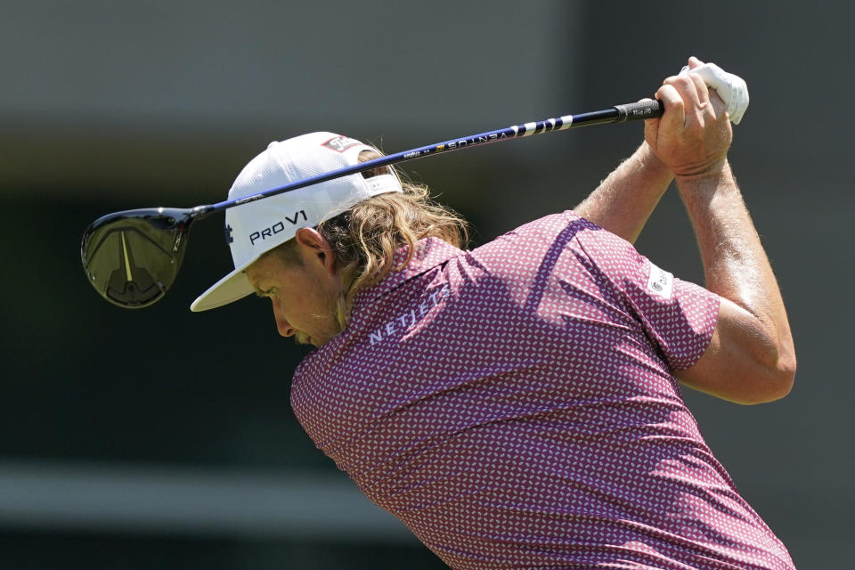 Cameron Smith, of Australia, hits on the sixth tee during the final round of the St. Jude Championship golf tournament, Sunday, Aug. 14, 2022, in Memphis, Tenn. (AP Photo/Mark Humphrey)