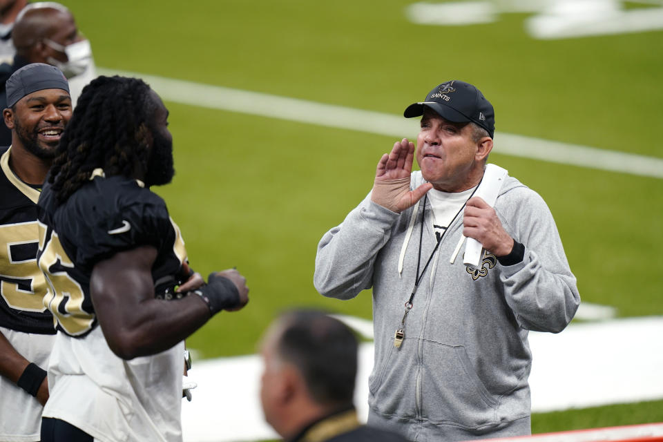 New Orleans Saints head coach Sean Payton laughs with players during NFL football practice in New Orleans, Thursday, Sept. 3, 2020. (AP Photo/Gerald Herbert, Pool)