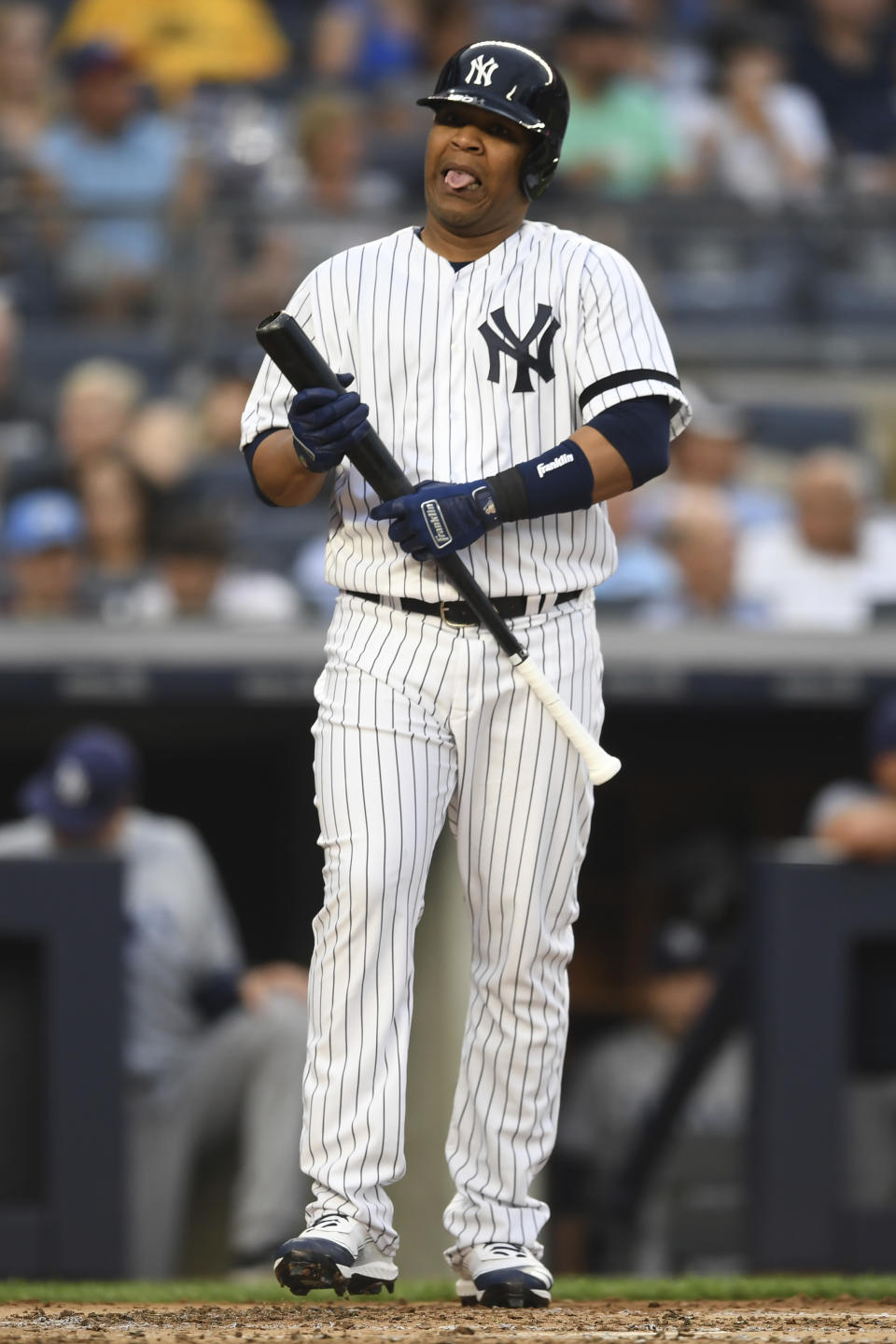 New York Yankees' Edwin Encarnacion reacts after striking out swinging during the second inning of a baseball game against the Tampa Bay Rays, Monday, June 17, 2019, in New York. (AP Photo/Sarah Stier)