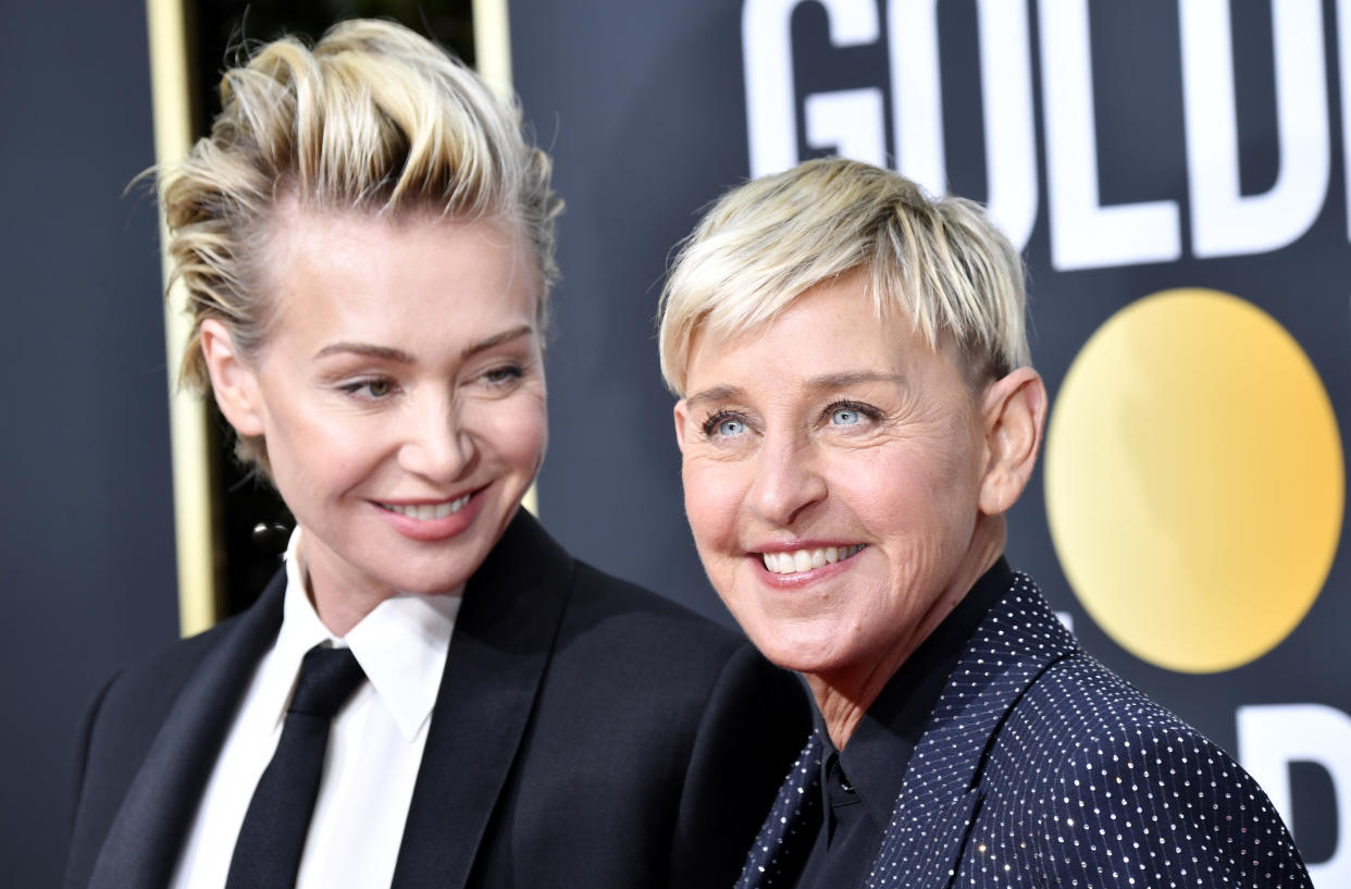 Portia de Rossi and Ellen DeGeneres cuddle in a new photo marking National Coming Out Day. (Photo: Frazer Harrison/Getty Images)