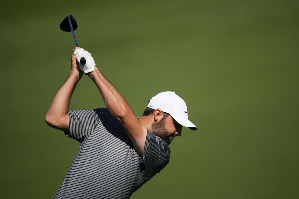 Scottie Scheffler hits on the practice range during a practice round in preparation for the Masters golf tournament at Augusta National Golf Club Monday, April 8, 2024, in Augusta, Ga. (AP Photo/Matt Slocum)