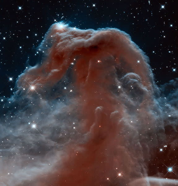 This new Hubble image, captured and released to celebrate the telescope’s 23rd year in orbit, shows part of the sky in the constellation of Orion (The Hunter). Rising like a giant seahorse from turbulent waves of dust and gas is the Horsehead N