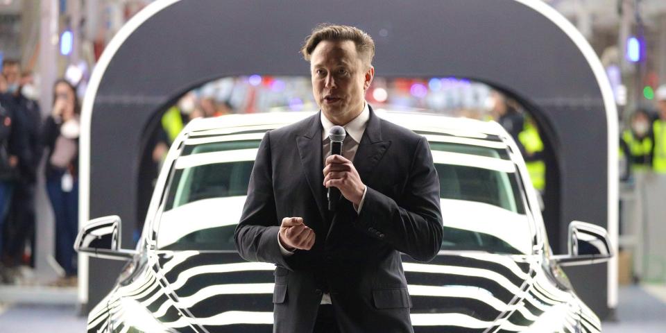Elon Musk speaks during the official opening of the new Tesla electric car manufacturing plant on March 22, 2022 near Gruenheide, Germany