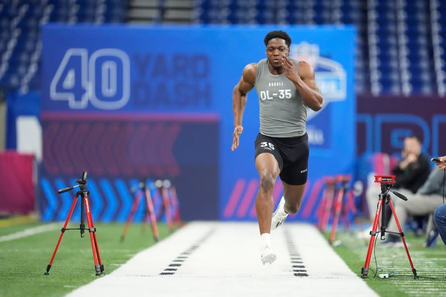 Penn State defensive lineman Adisa Isaac runs the 40-yard dash at the NFL football scouting combine, Thursday, Feb. 29, 2024, in Indianapolis. (AP Photo/Michael Conroy)