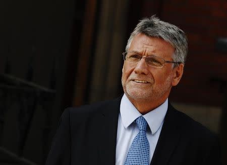 Neil Wallis, former deputy editor at the News of the World, leaves the Leveson Inquiry into media practices at the High Court in London April 2, 2012. REUTERS/Luke MacGregor