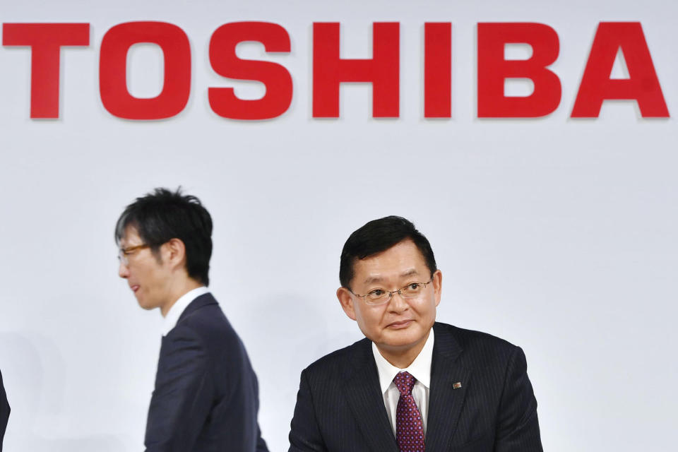 In this November 2018, photo, then Toshiba Corp., Chairman and CEO Nobuaki Kurumatani gets out of a seat after a press conference in Tokyo. Kurumatani stepped down Wednesday, April 14, 2021, a week after the Japanese technology and manufacturing conglomerate said it was studying an acquisition proposal from a global fund where he previously worked. Kurumatani tendered his resignation at a board meeting, and the board accepted, effective Wednesday, Tokyo-based Toshiba said in a statement. (Yoshitaka Sugawara/Kyodo News via AP)