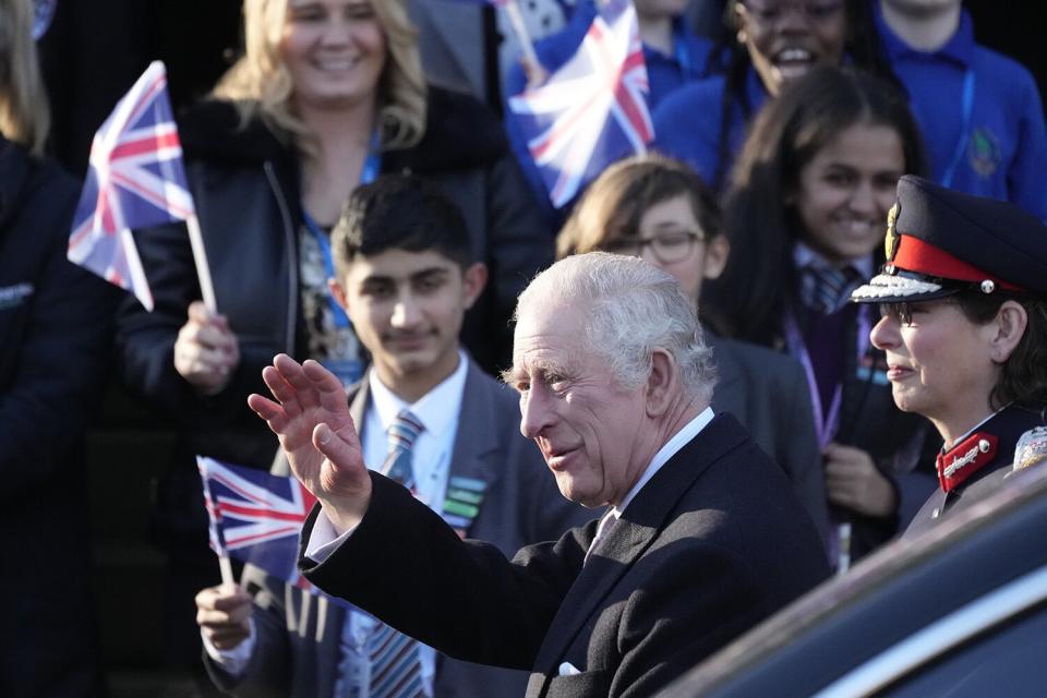 King Charles III is welcomed by a crowd as he and Camila, Queen Consort arrive at Bolton Town House