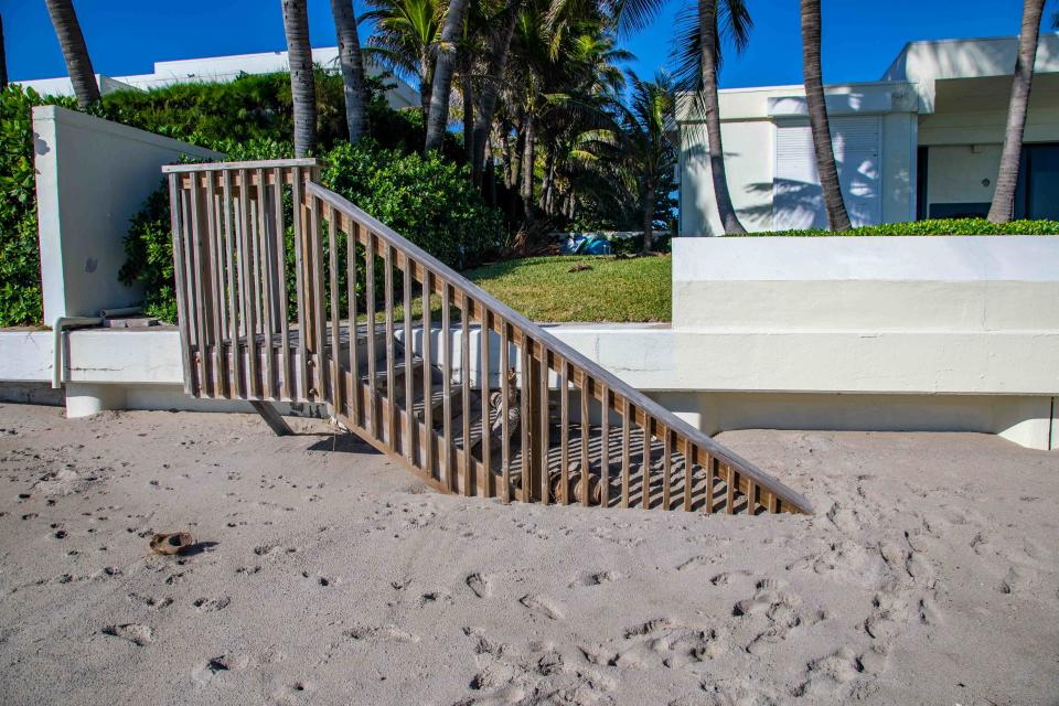 Sand covers stairs Monday leading from homes to the beach near Mar-a-Lago following Hurricane Nicole.