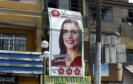 Presidential candidate Veronika Mendoza's campaign poster is seen in a street in the Chorrillos district of Lima, Peru, April 8, 2016. REUTERS/Mariana Bazo