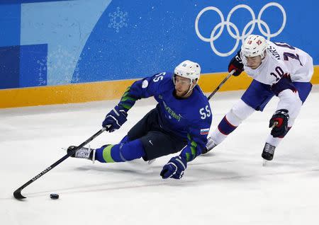 Ice Hockey - Pyeongchang 2018 Winter Olympics - Men's Playoff Match - Slovenia v Norway - Gangneung Hockey Centre, Gangneung, South Korea - February 20, 2018 - Mattias Norstebo of Norway and Robert Sabolic of Slovenia in action. REUTERS/Grigory Dukor