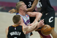 Cleveland Cavaliers' Dylan Windler, left, knocks the ball loose from Detroit Pistons' Mason Plumlee in the second half of an NBA basketball game, Wednesday, Jan. 27, 2021, in Cleveland. (AP Photo/Tony Dejak)
