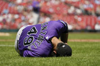 Colorado Rockies starting pitcher Antonio Senzatela reacts after being injured while covering first base during the second inning of a baseball game against the St. Louis Cardinals Thursday, Aug. 18, 2022, in St. Louis. Senzatela left the game. (AP Photo/Jeff Roberson)