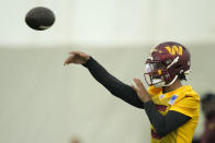 Washington Commanders first round draft pick quarterback Jayden Daniels warms up during an NFL rookie minicamp football practice in Ashburn, Va., Friday, May 10, 2024. (AP Photo/Susan Walsh)