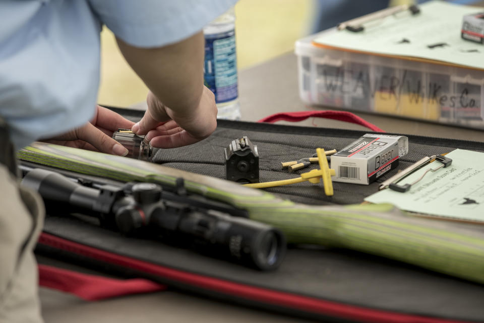 Reloading at the .22 Rimfire Silhouette Exhibition Match. (Photo: Ben Rollins for Yahoo News)