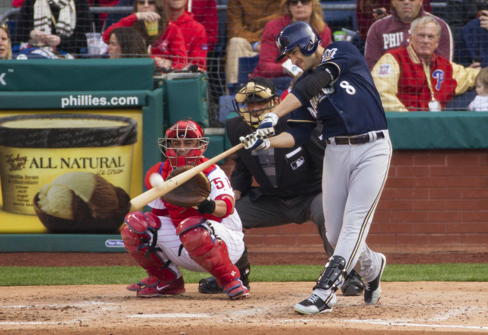 Milwaukee Brewers' Ryan Braun hits a solo home run in front of Philadelphia Phillies catcher Carlos Ruiz (51) during the fourth inning of a baseball game, Tuesday, April 8, 2014, in Philadelphia. (AP Photo/Chris Szagola)