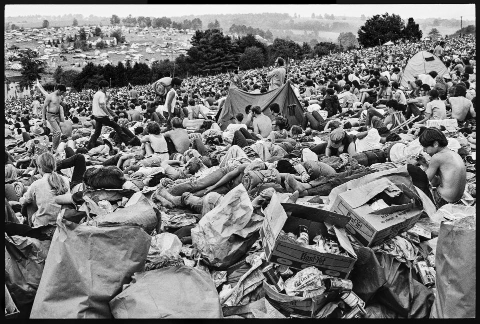 A crowd on the hillside at Woodstock. | Burk Uzzle