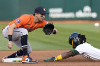 Oakland Athletics' Esteury Ruiz, right, steals second base against Houston Astros shortstop Mauricio Dubón, left, during the first inning of a baseball game in Oakland, Calif., Friday, May 26, 2023. (AP Photo/Godofredo A. Vásquez)