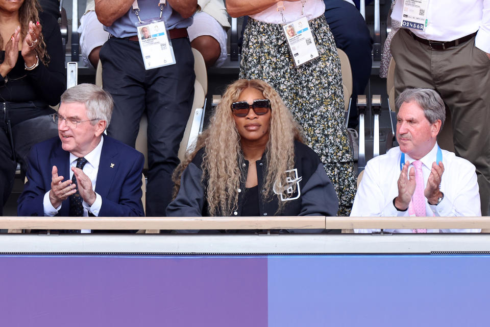 L to R: Thomas Bach and Serena Williams attend the men's singles tennis final at the 2024 Paris Olympics on Aug. 4, Nike, letterman jacket