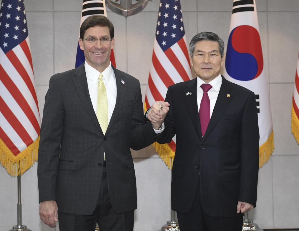 U.S. Defense Secretary Mark Esper, left, shakes hands with South Korean Defense Minister Jeong Kyeong-doo before their meeting Friday, Nov. 15, 2019, in Seoul, South Korea. (Kim Min-hee/Pool Photo via AP)