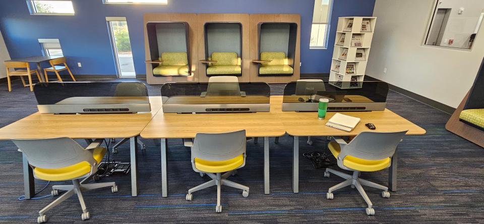 The library offers a quiet reading room that features private pods and desk space.