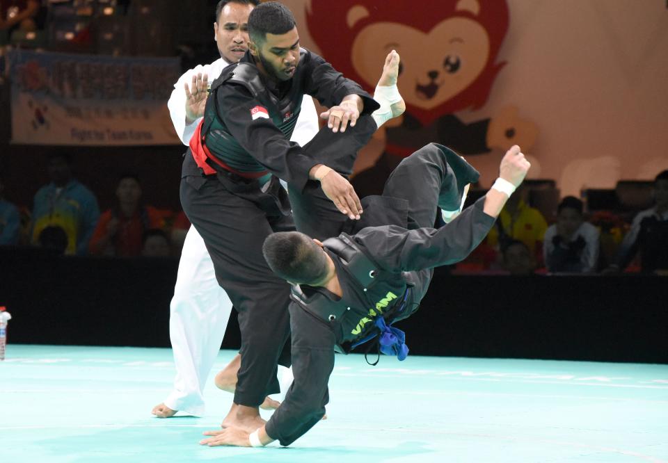 Singapore’s Sheik Farhan celebrated his 21st birthday with a gold medal in the men’s Class J division, after claiming victory against Pham Khac Thuong from Vietnam on 16 December, 2018. (PHOTO: Singapore Silat Federation)