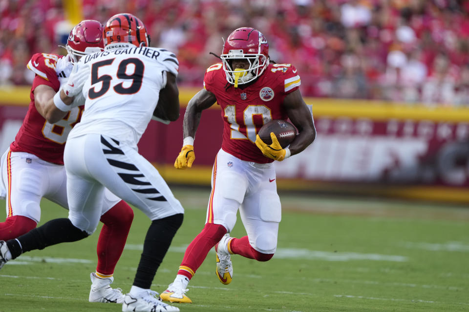 Kansas City Chiefs running back Isiah Pacheco (10) runs with the ball as Cincinnati Bengals linebacker Akeem Davis-Gaither (59) defends during the first half of an NFL football game Sunday, Sept. 15, 2024, in Kansas City, Mo. (AP Photo/Charlie Riedel)