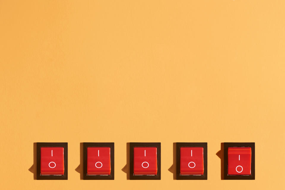 Five Rocker Switches On Orange Background