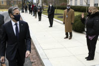 Secretary of State Antony Blinken is greeted by staff as he arrives at the State Department in Washington, Wednesday, Jan. 27, 2021. (Carlos Barria/Pool Photo via AP)