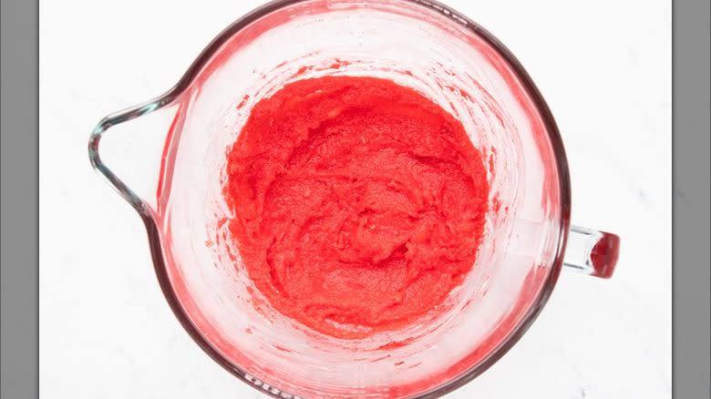 Red dough in glass bowl