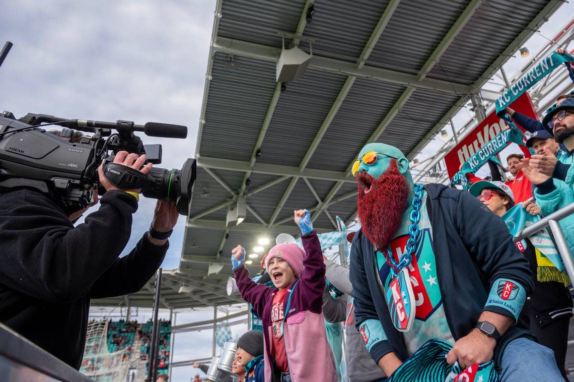 Richard Harper, draped in Kansas City Current colors, with his face and beard painted to match, passionately addresses the video camera during an NWSL game between Kansas City Current and Bay FC on Saturday, April 20, 2024, in Kansas City.