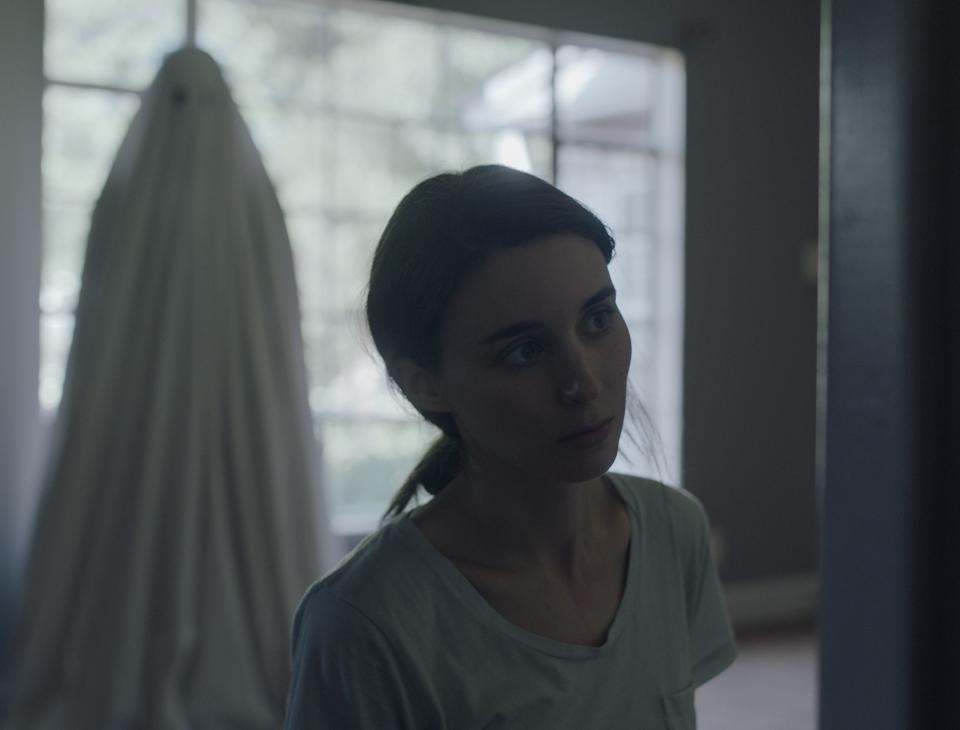 M (Rooney Mara) is haunted by her lover's ghost (Casey Affleck) in the eerie emotional drama "A Ghost Story."