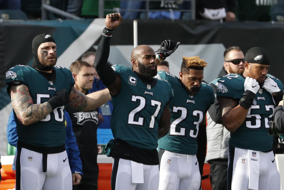 Philadelphia Eagles’ Chris Long, from left, Malcolm Jenkins and Rodney McLeod gesture during the national anthem on Sunday. (AP)