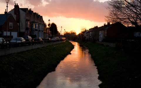 Sincil Bank Drain and Altham Terrace, in Lincoln, at sunset  - Credit: Douglas Scott/Alamy