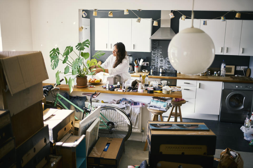 Woman in a cluttered home. (Getty Images)
