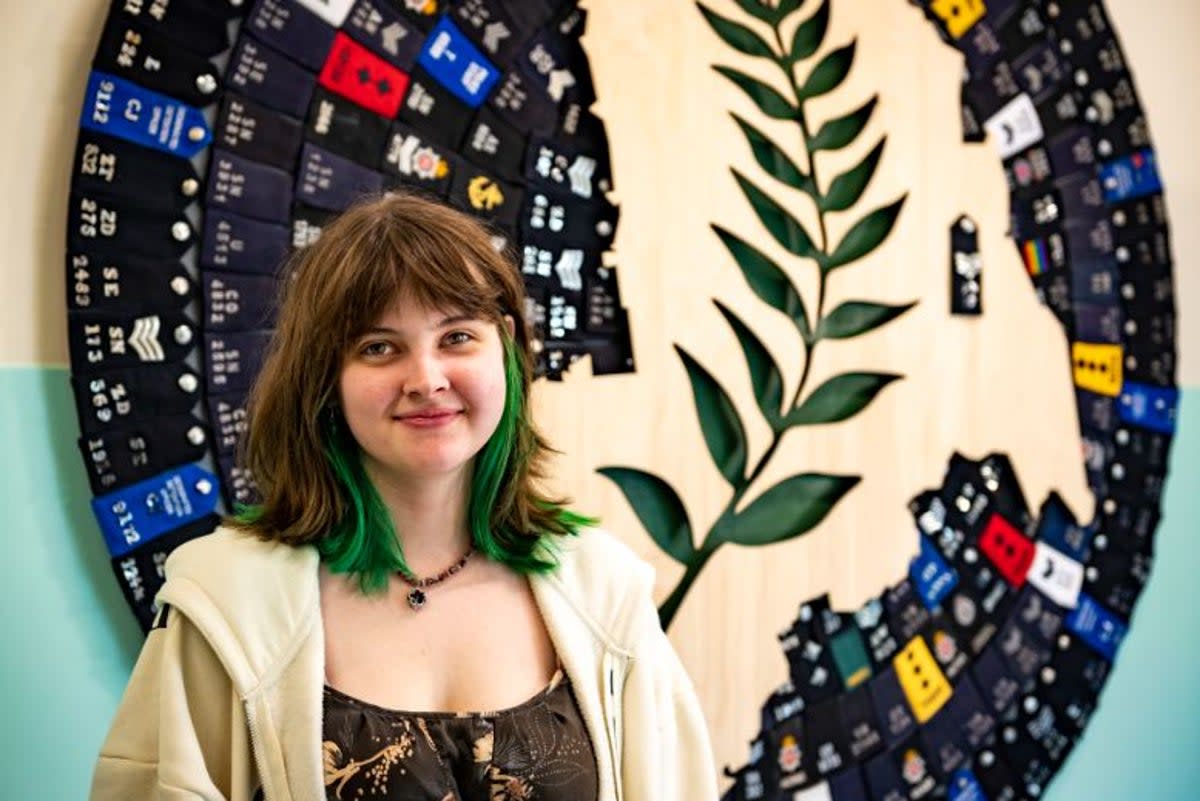 Georgina Pender stands in front of the artwork she created (Met Police)