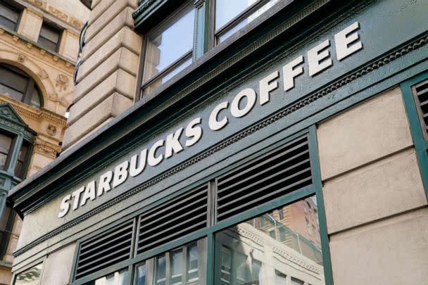 PHOTO: A Starbucks sign is displayed above a store in the Financial District of Lower Manhattan, June 13, 2023, in New York. (John Minchillo/AP)